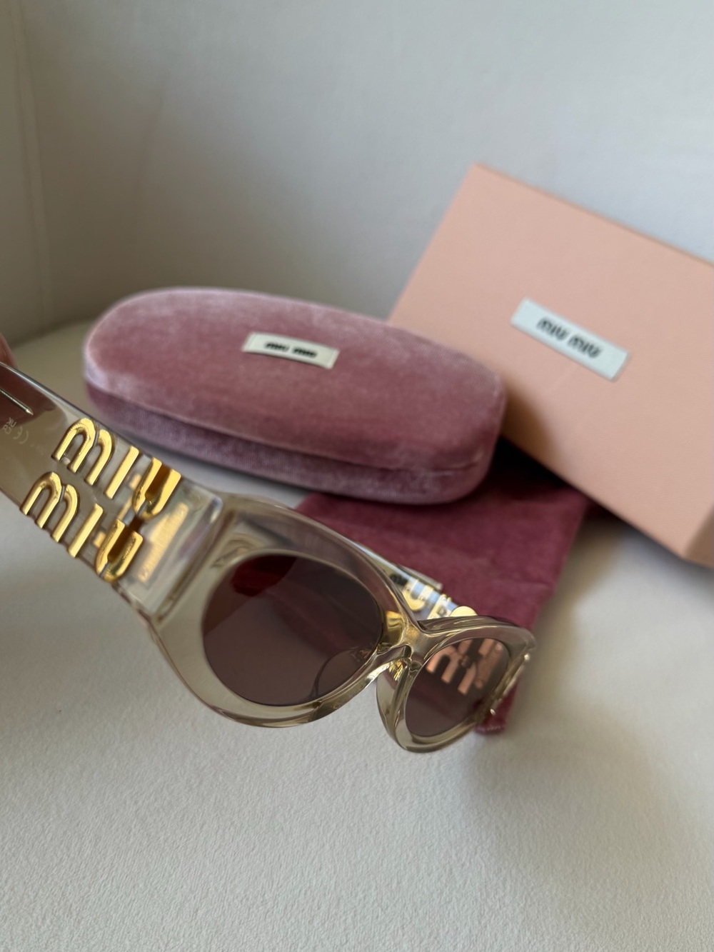 Miu Miu Pale Pink Transparent Logo Cat-Eye Sunglasses